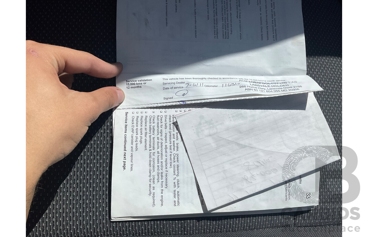 2/2010 Holden Barina TK MY10 3d Hatchback Black 1.6L