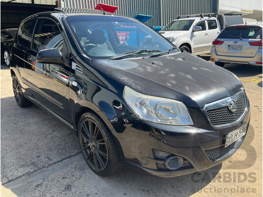 2/2010 Holden Barina TK MY10 3d Hatchback Black 1.6L