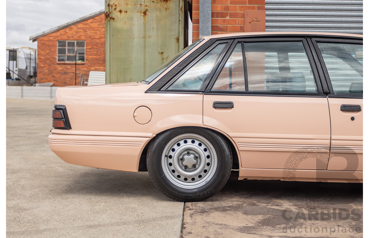 6/1988 Holden VL Commodore Executive 4d Sedan Pastel Pink Turbo 3.0L