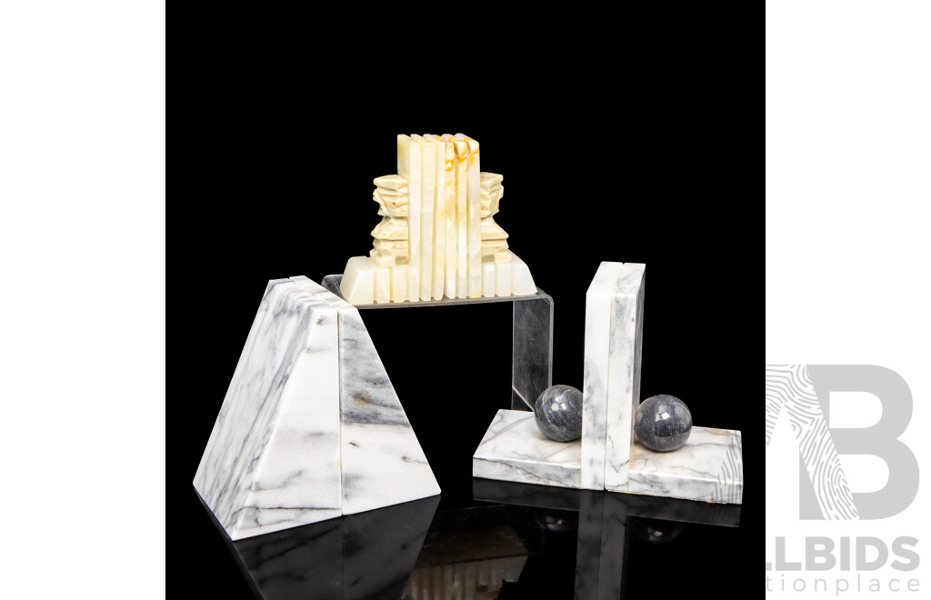 Three Pairs of Marble Bookends, Including Carved Aztec, Wedge, and Sphere Forms