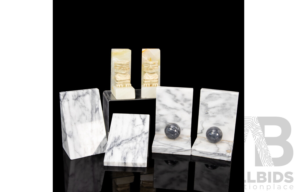 Three Pairs of Marble Bookends, Including Carved Aztec, Wedge, and Sphere Forms