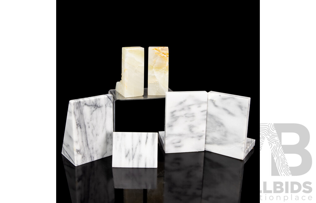 Three Pairs of Marble Bookends, Including Carved Aztec, Wedge, and Sphere Forms