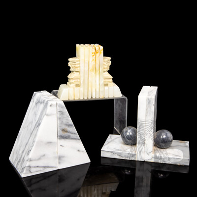 Three Pairs of Marble Bookends, Including Carved Aztec, Wedge, and Sphere Forms