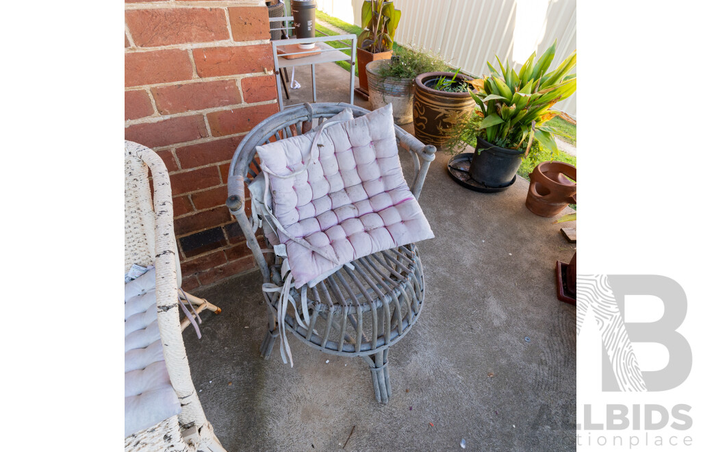 Pair of Unmatched Verandah Chairs Including a Seagrass and Bent Cane Example