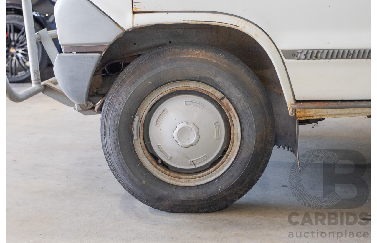 3/1977 Toyota Dyna 4d Tray Back Solid White 2.0L