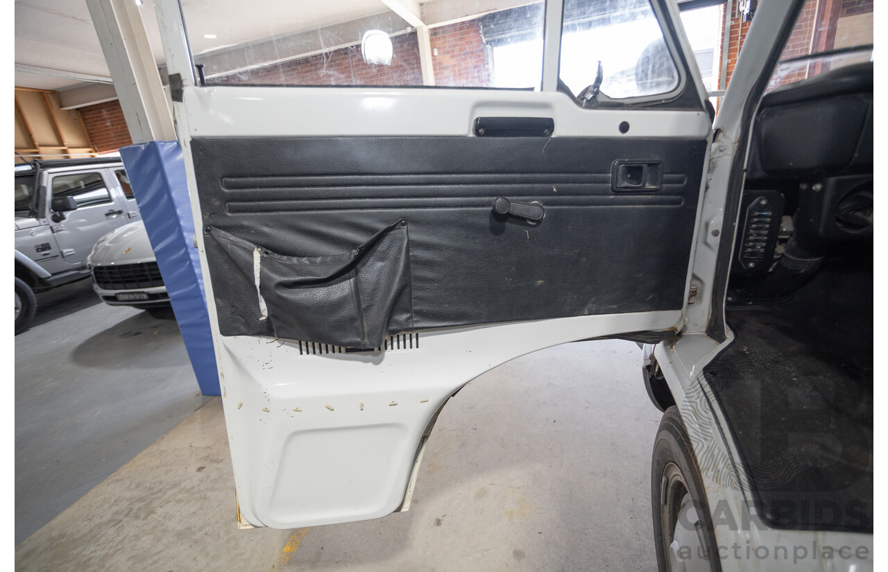 3/1977 Toyota Dyna 4d Tray Back Solid White 2.0L