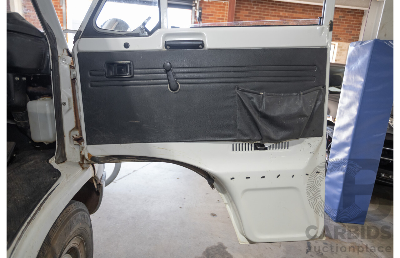 3/1977 Toyota Dyna 4d Tray Back Solid White 2.0L