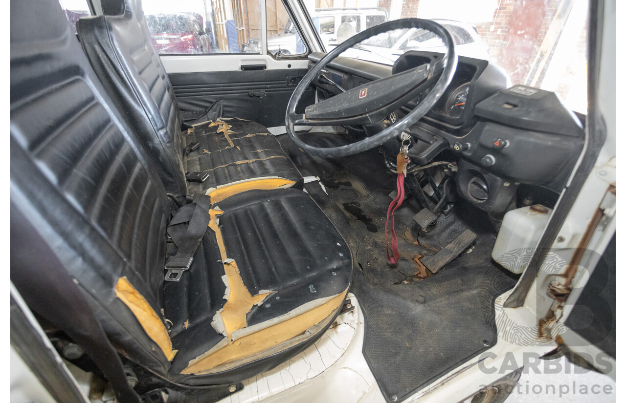 3/1977 Toyota Dyna 4d Tray Back Solid White 2.0L