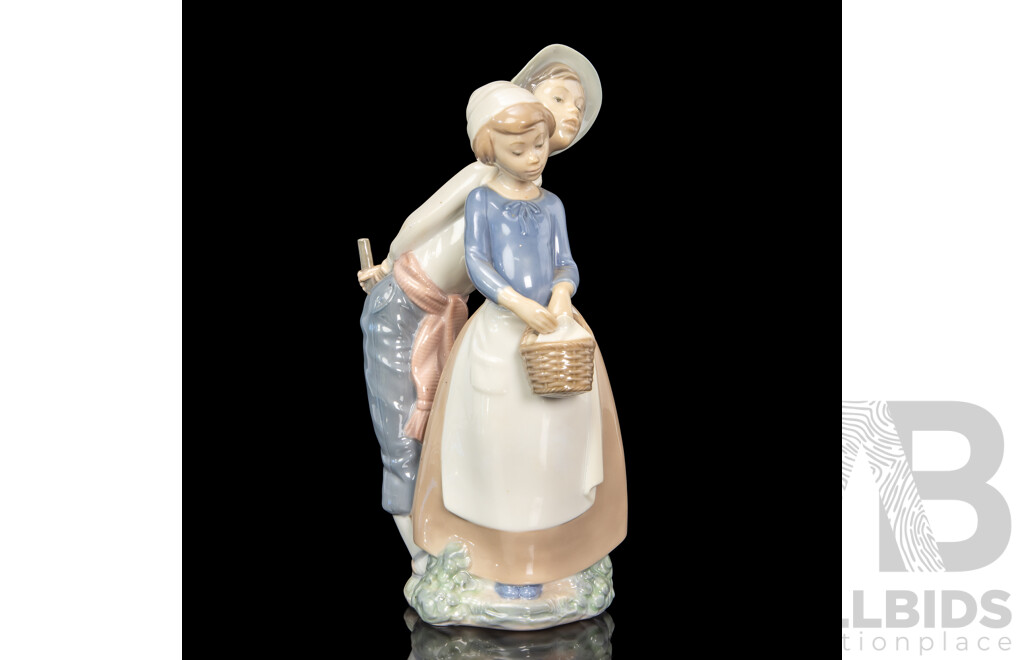 Large Porcelain ‘Goody Basket’ Figures of a Young Couple by Nao for Lladró