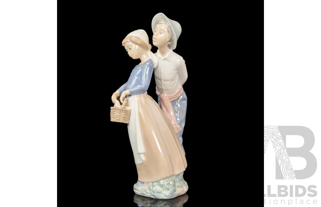 Large Porcelain ‘Goody Basket’ Figures of a Young Couple by Nao for Lladró