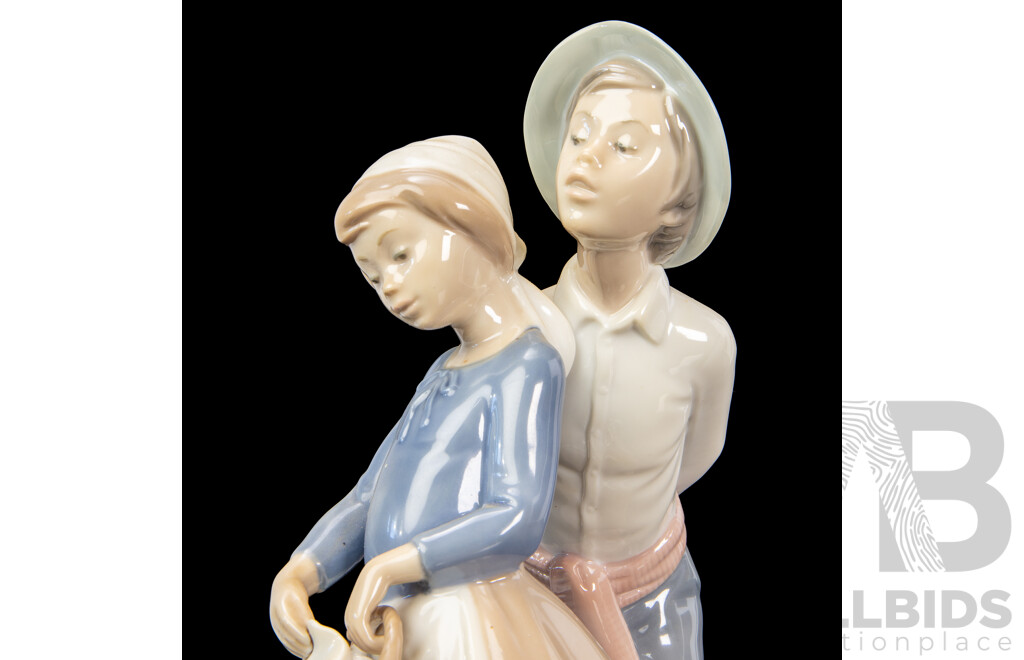 Large Porcelain ‘Goody Basket’ Figures of a Young Couple by Nao for Lladró
