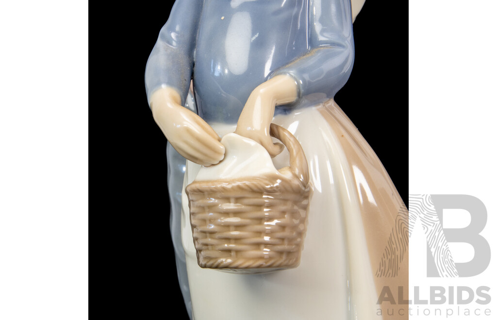 Large Porcelain ‘Goody Basket’ Figures of a Young Couple by Nao for Lladró
