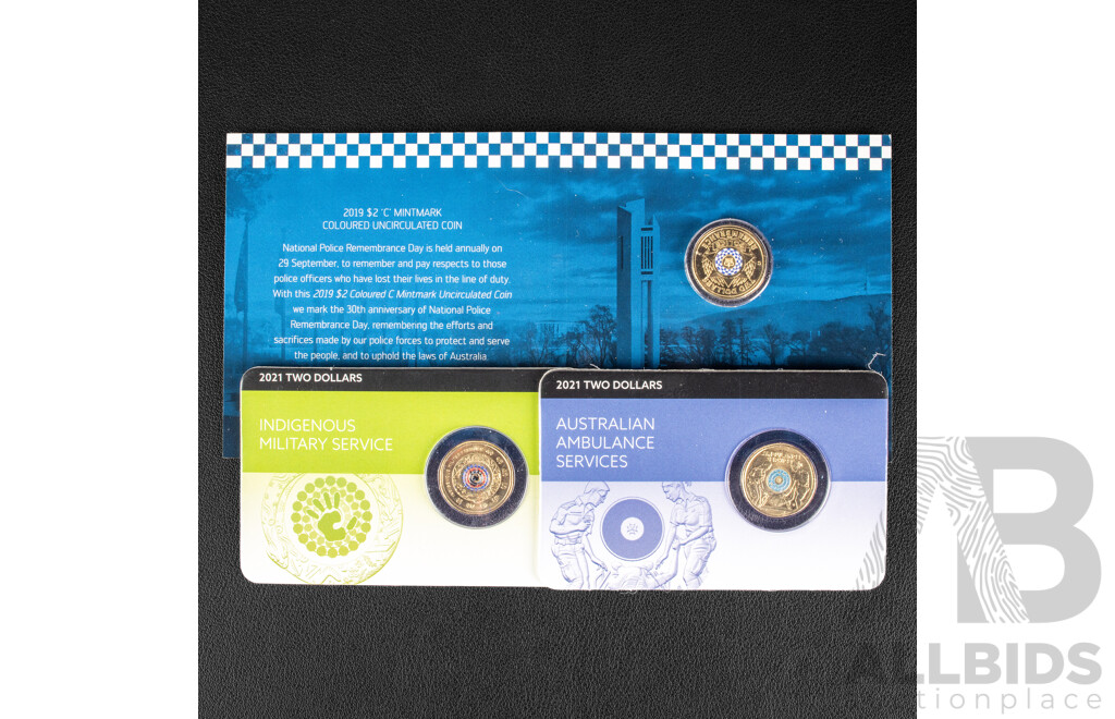 Three Australian Commemorative Two Dollar Coins Including 2021 Australian Ambulance Services, 2021 Indigenous Military Service, 2019 Police Remembrance C Mint Mark