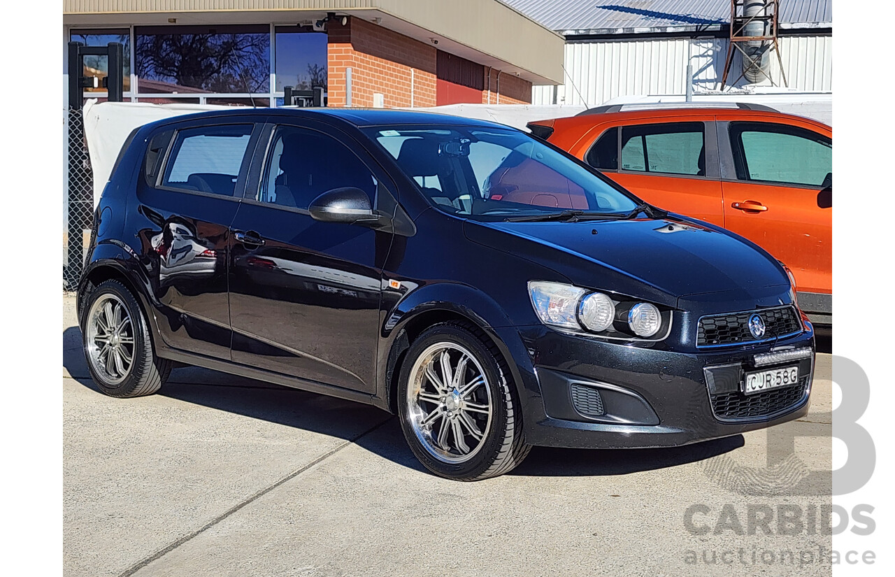 8/2012 Holden Barina  TM 5d Hatchback Black 1.6L
