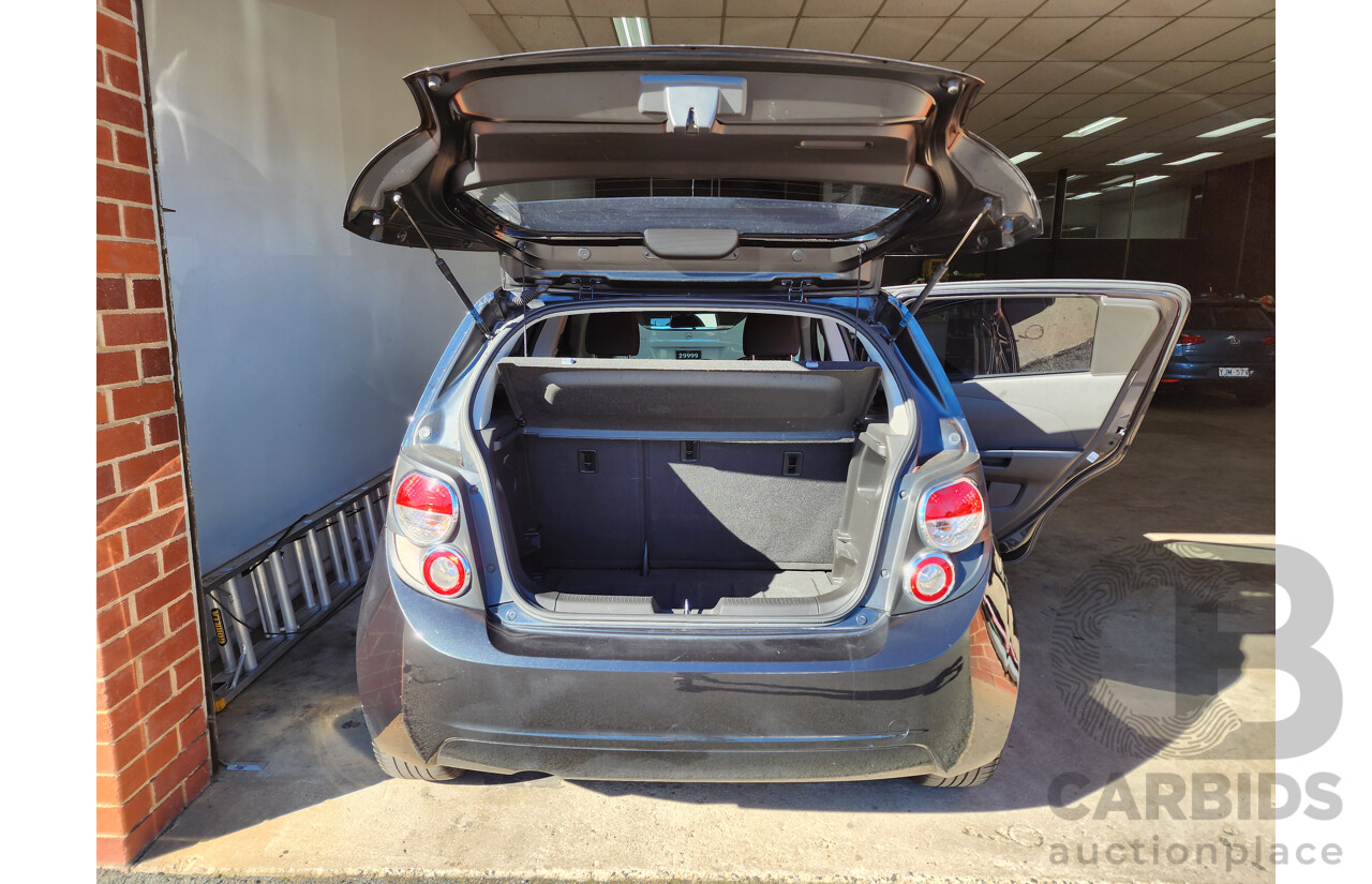 8/2012 Holden Barina  TM 5d Hatchback Black 1.6L