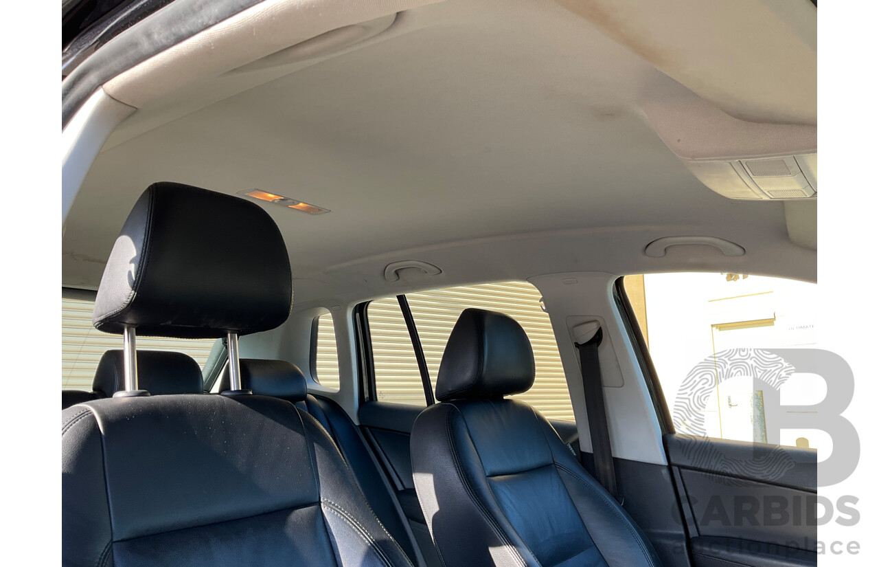 2/2010 Volkswagen Tiguan 103 TDI Pacific 5NC MY10 4d Wagon Black 2.0L