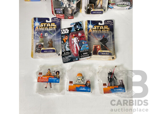 Collection of Star Wars Figures in Original Packaging