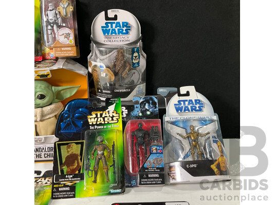 Collection of Star Wars Figures in Original Packaging