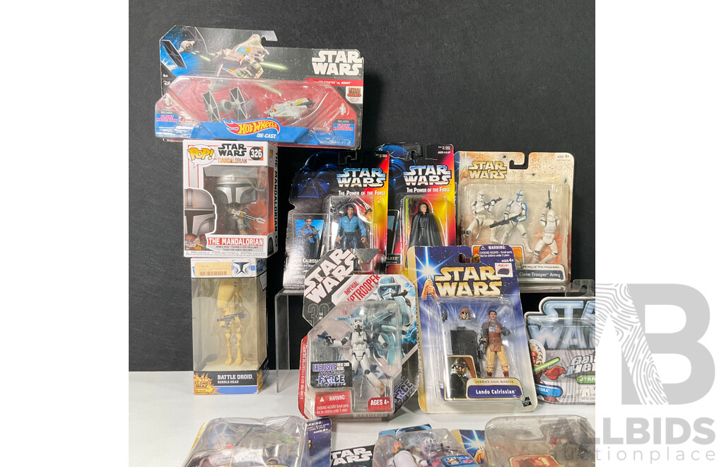 Collection of Star Wars Figures in Original Packaging