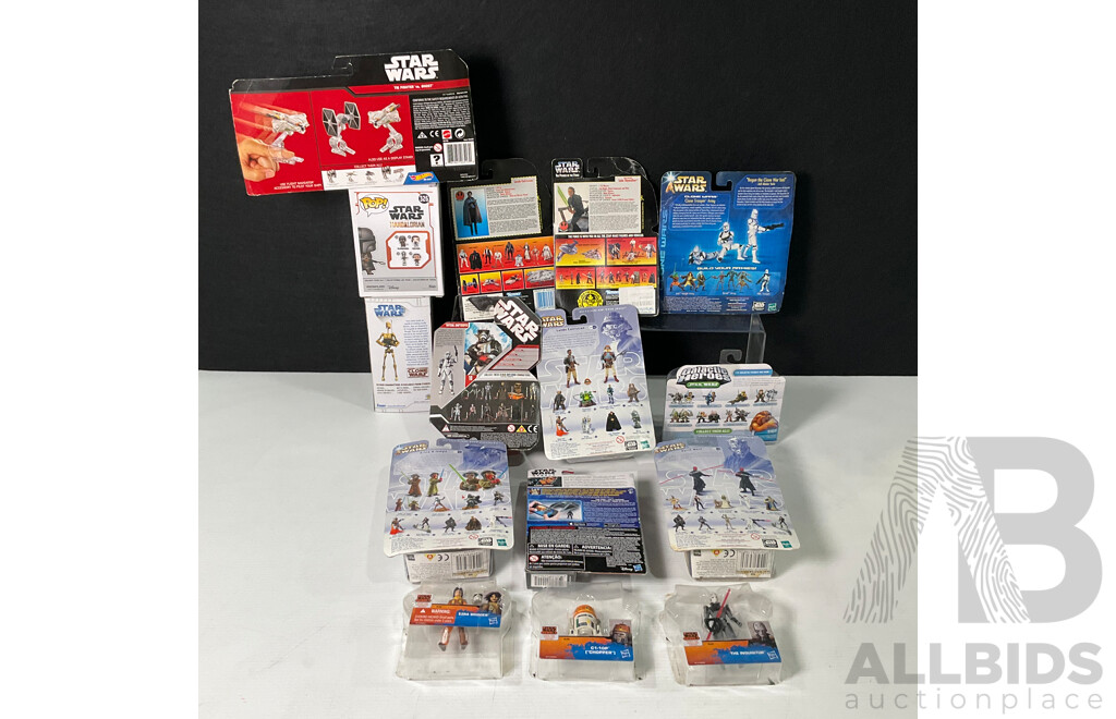 Collection of Star Wars Figures in Original Packaging