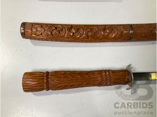 1661399 · Three Vintage South East Asian Swords with Timber Scabbards