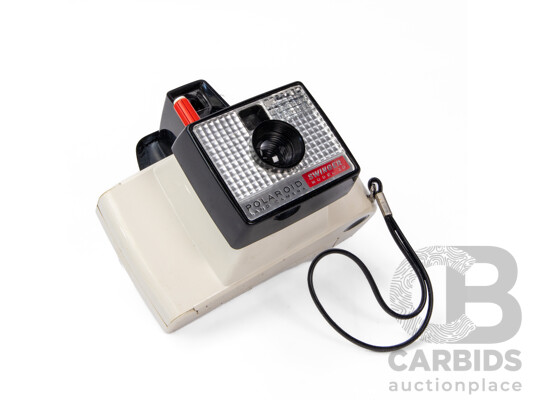 Two Vintage Polaroid Cameras with Carry Cases and User Manuals