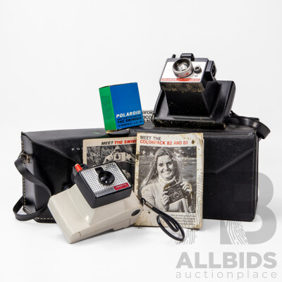 Two Vintage Polaroid Cameras with Carry Cases and User Manuals