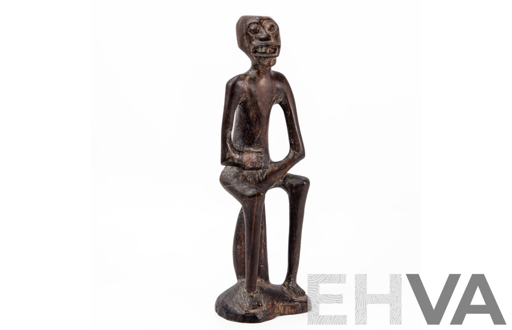 Carved Central African Figure of a Seated Man