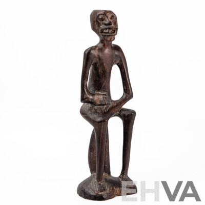 Carved Central African Figure of a Seated Man