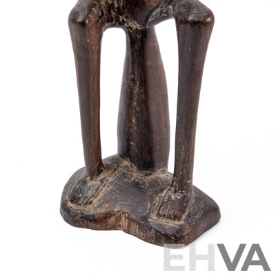 Carved Central African Figure of a Seated Man