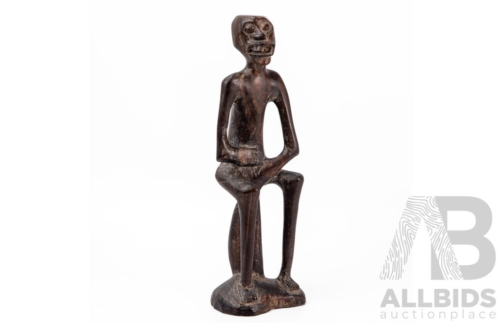 Carved Central African Figure of a Seated Man