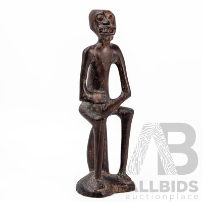 Carved Central African Figure of a Seated Man