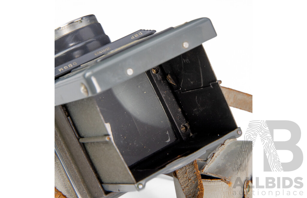 Grey Rolleiflex 4×4 Baby TLR Camera with Xenar 60mm F/3.5 Lens and Rollei Lens Hood