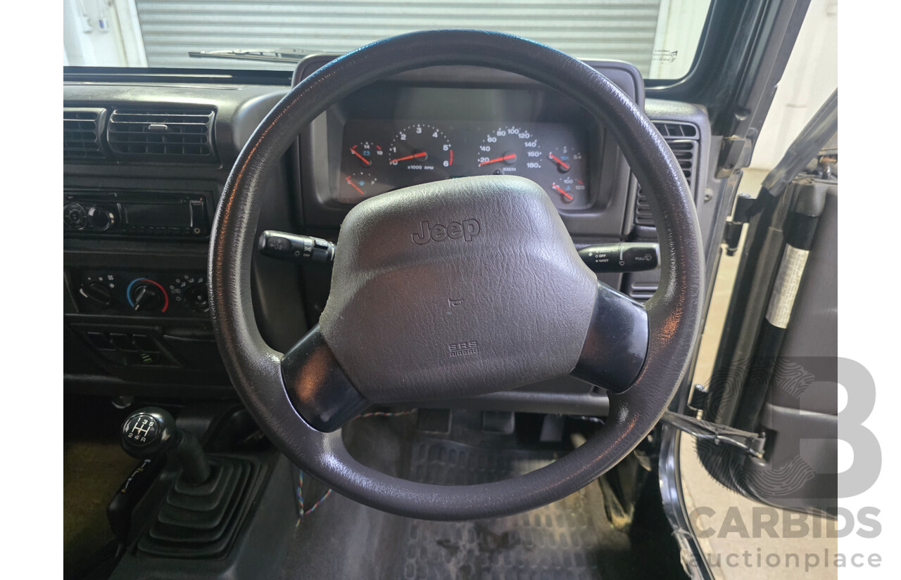 10/2002 Jeep Wrangler Sport (4x4) TJ 2d Softtop Black V6 4.0L