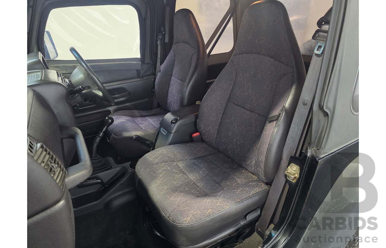 10/2002 Jeep Wrangler Sport (4x4) TJ 2d Softtop Black V6 4.0L