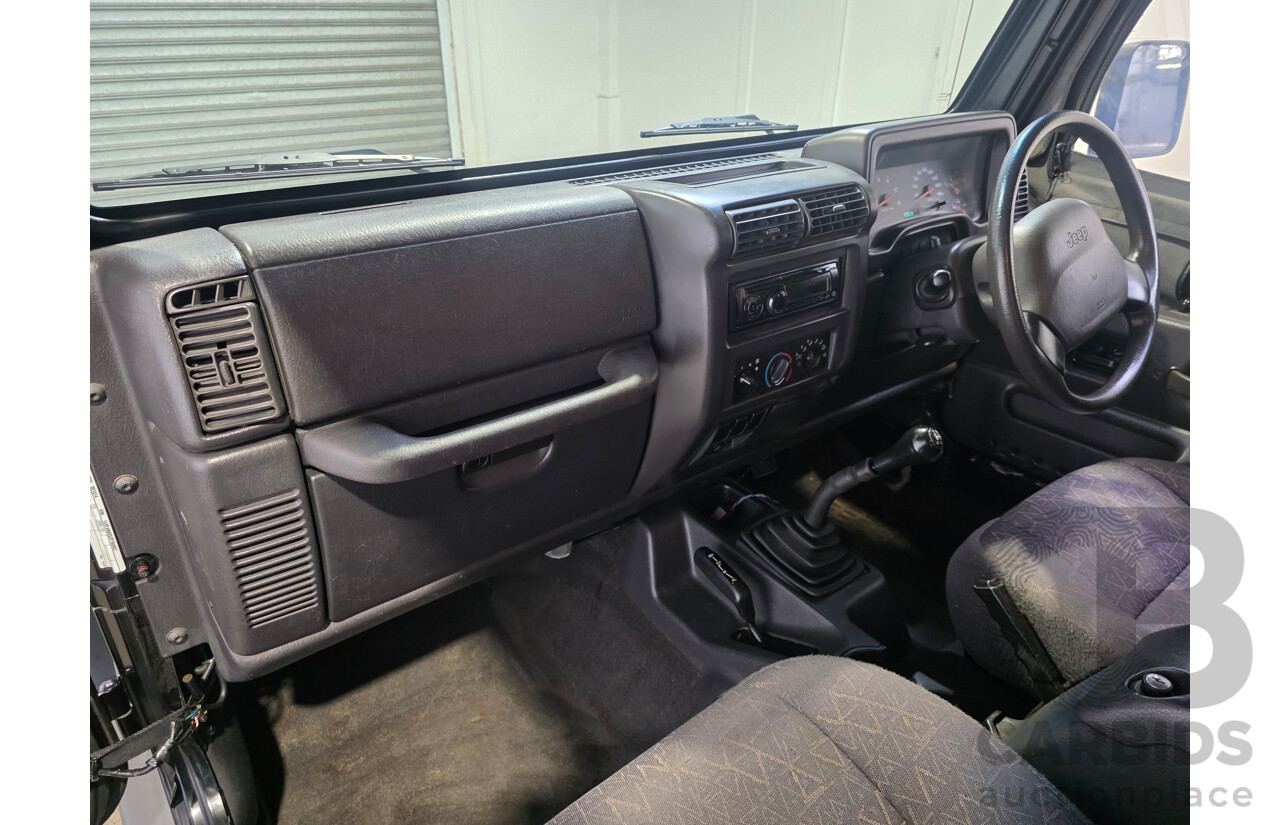 10/2002 Jeep Wrangler Sport (4x4) TJ 2d Softtop Black V6 4.0L