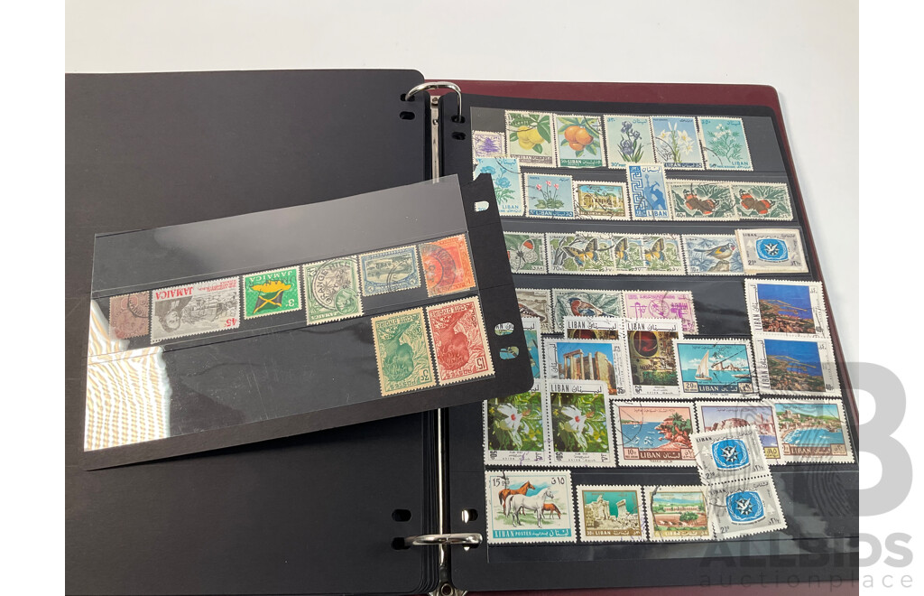Album of Vintage and Antique International Stamps Including Hungary, Malta, Ireland, Maldives, Luxembourg, Liberia, Indonesia, Netherlands, Kenya, Jordan, Libam, Latvia, Iran