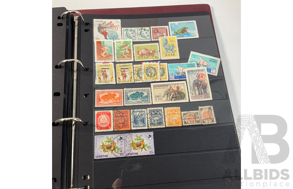 Album of Vintage and Antique International Stamps Including Hungary, Malta, Ireland, Maldives, Luxembourg, Liberia, Indonesia, Netherlands, Kenya, Jordan, Libam, Latvia, Iran