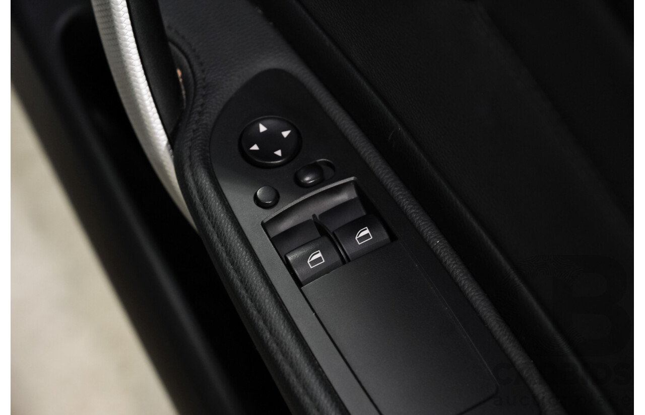 4/2010 BMW 135i Sport E82 MY11 2d Coupe Alpin White Turbo 3.0L