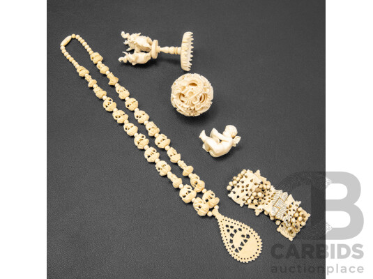 Collection of Carved Bone Items Including Puzzle Ball on Stand, Putti, Elephant Themed Necklace and More