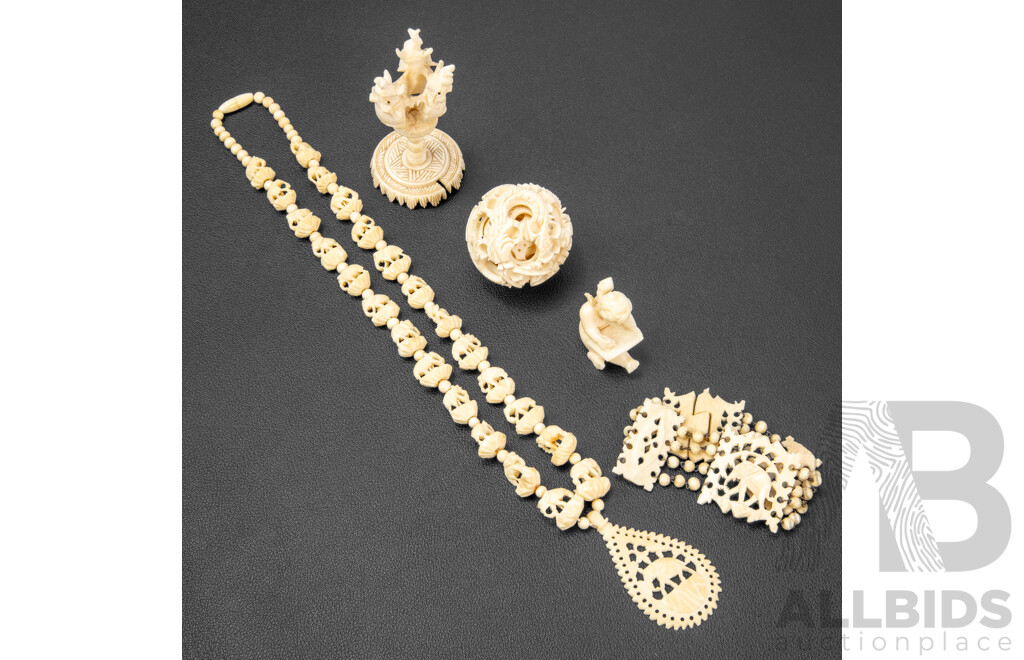Collection of Carved Bone Items Including Puzzle Ball on Stand, Putti, Elephant Themed Necklace and More