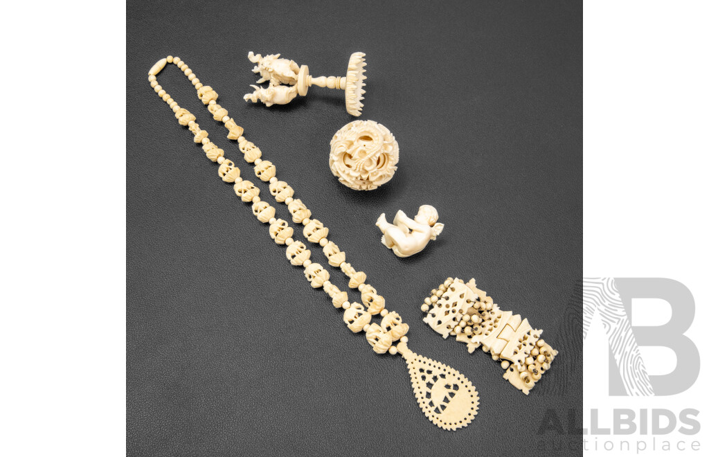 Collection of Carved Bone Items Including Puzzle Ball on Stand, Putti, Elephant Themed Necklace and More