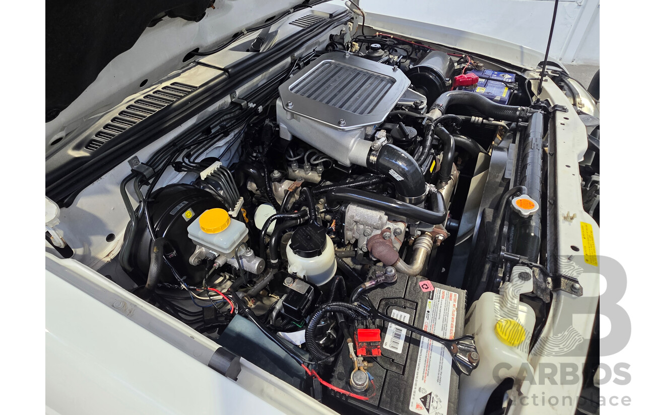 2/2012 Nissan Navara ST-R 4x4 D22 Series 5 Dual Cab White 2.5L