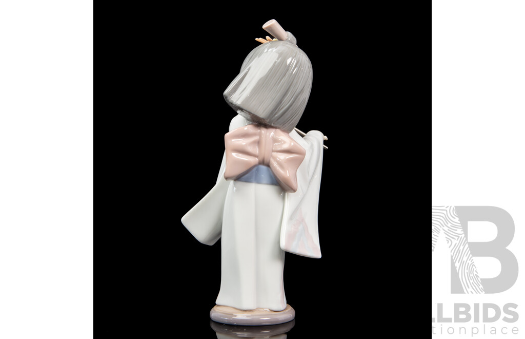 Boxed Lladro 'Playing the Flute' Porcelain Figure