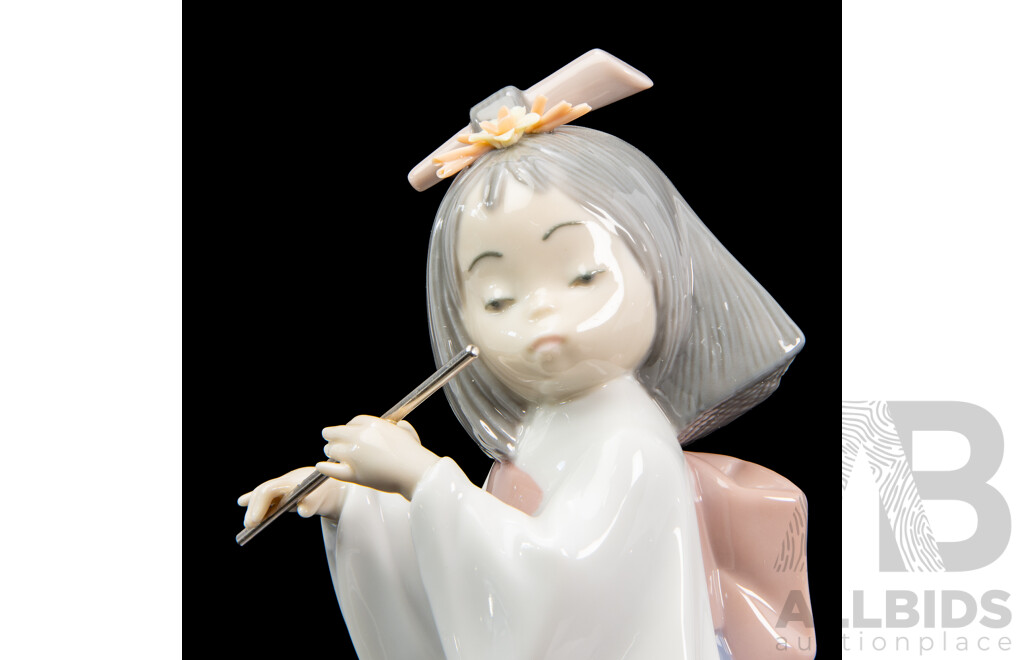 Boxed Lladro 'Playing the Flute' Porcelain Figure