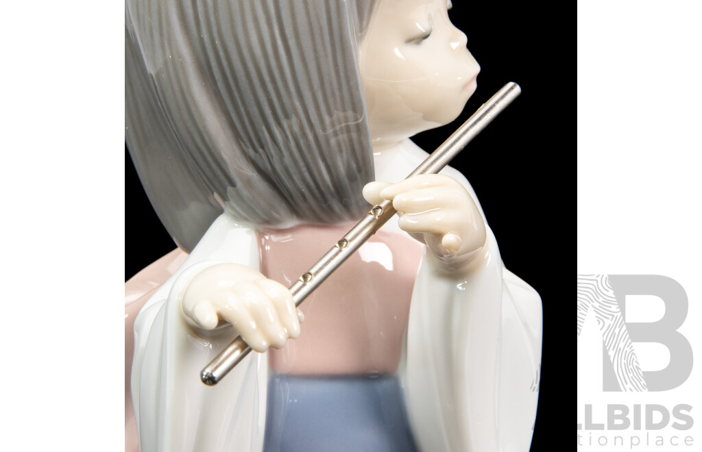 Boxed Lladro 'Playing the Flute' Porcelain Figure