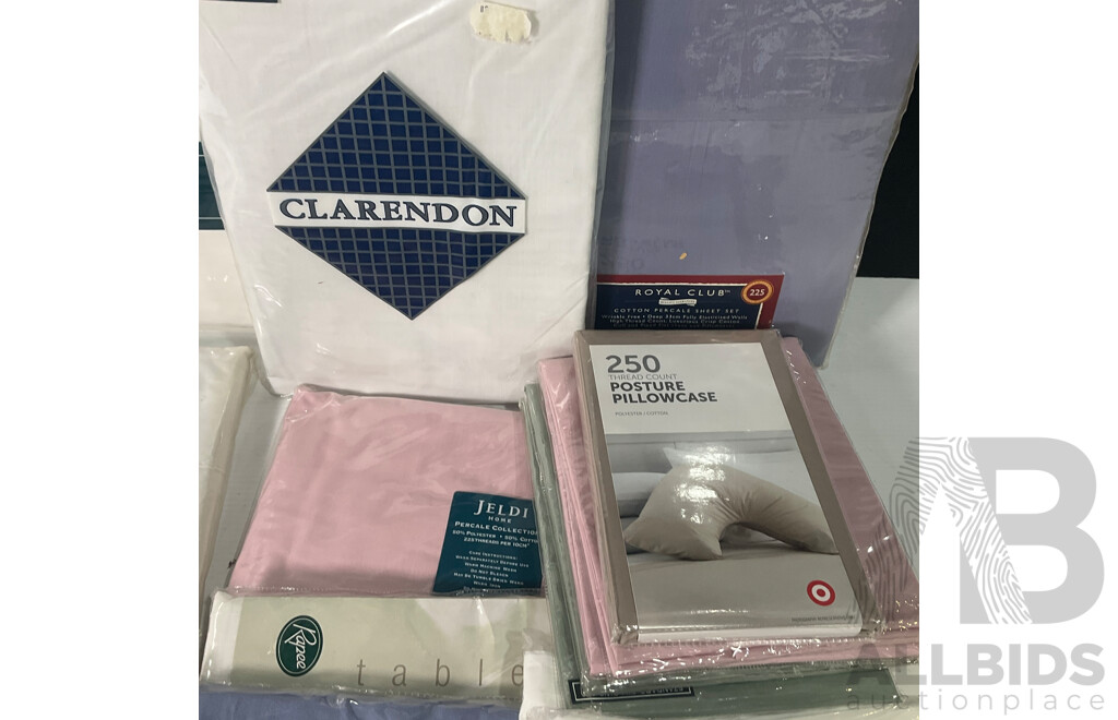 Collection of Linen Including Bed Sheets and Pillowcases