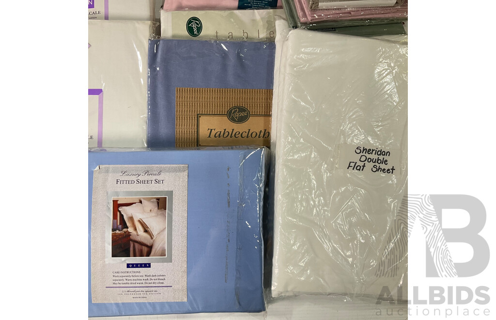 Collection of Linen Including Bed Sheets and Pillowcases