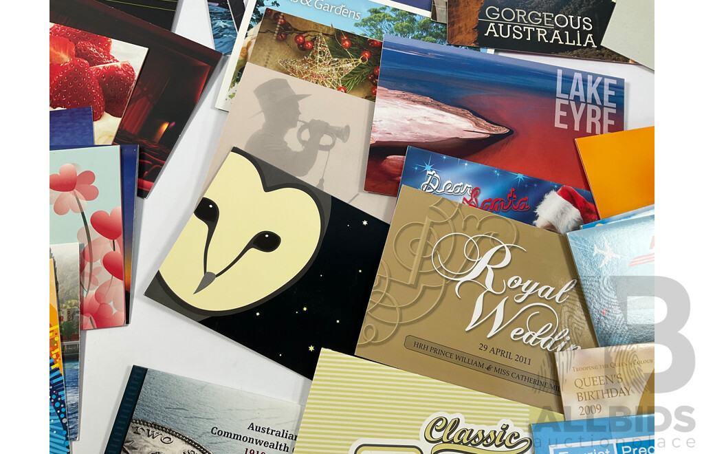 Fifty Six Australian Mint Stamp Packs Including Queensland 150 Years, Stargazing, Species at Risk, with Love, Beijing 2008, Gorgeous Australia, Living Green, Australian Commonwealth Coinage and More Face Value Approximately $217