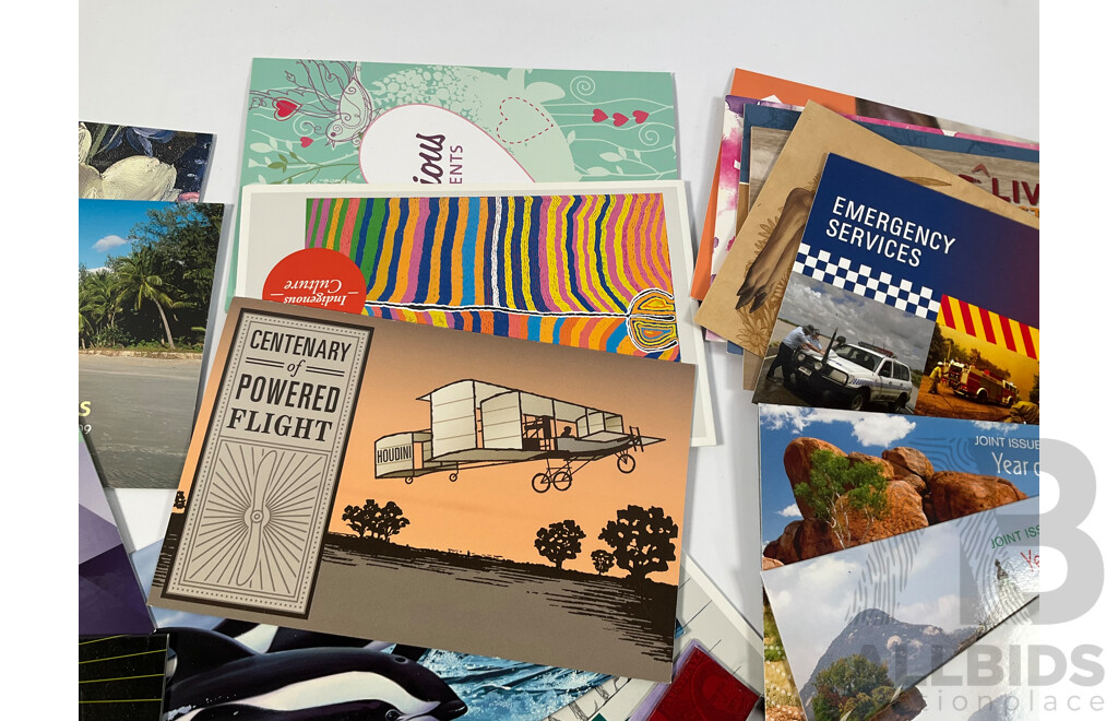 Fifty Six Australian Mint Stamp Packs Including Queensland 150 Years, Stargazing, Species at Risk, with Love, Beijing 2008, Gorgeous Australia, Living Green, Australian Commonwealth Coinage and More Face Value Approximately $217